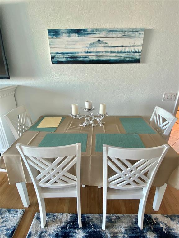 6035 Sea Ranch Drive, Unit 901 Hudson, FL 34667 - Photo 7 of 72 a view of a dining room with furniture