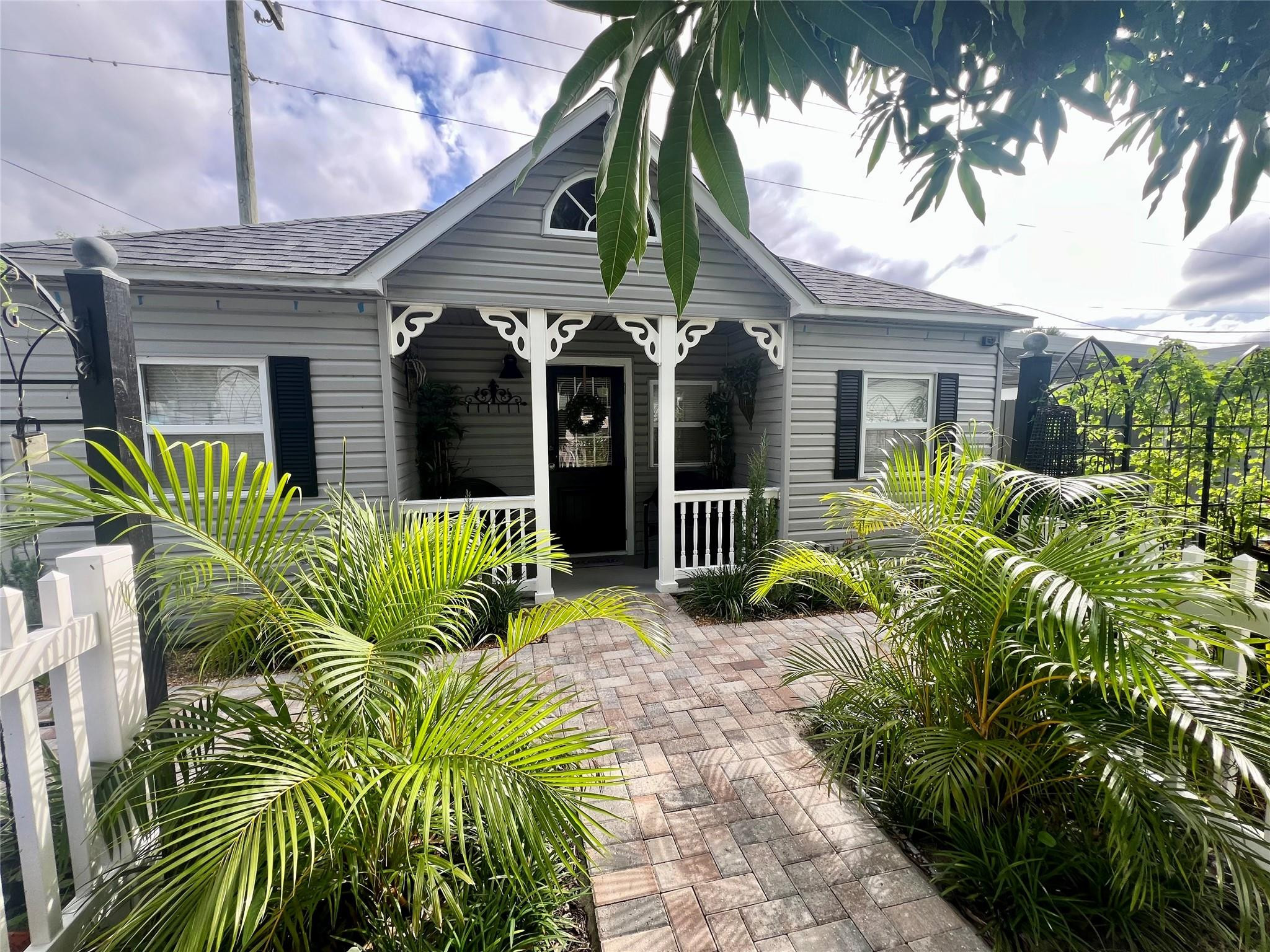 a view of a house with a flower garden