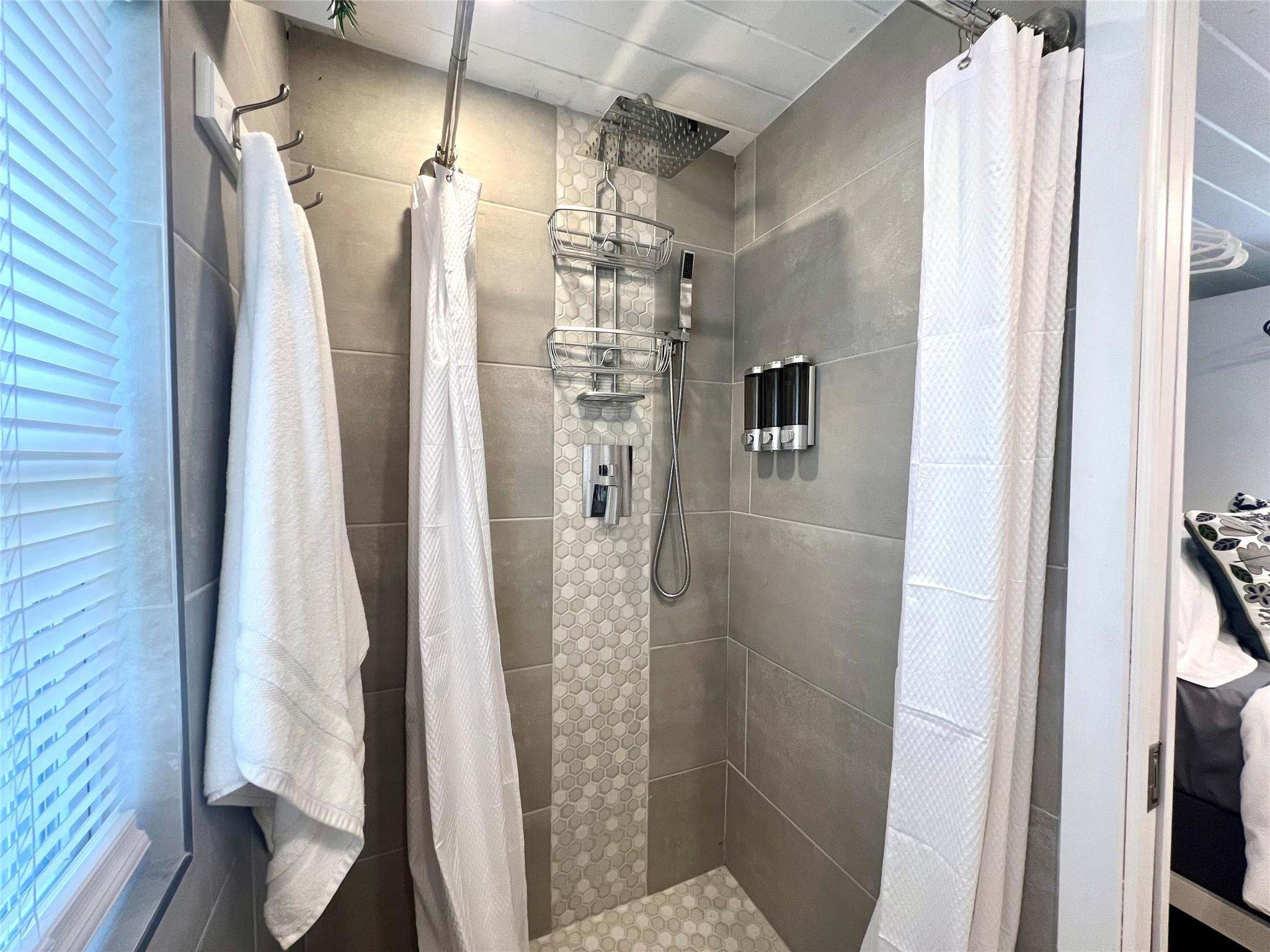 12 Southwest 6th Street Delray Beach, FL 33444 - Photo 5 of 9 a bathroom with a shower and a toilet