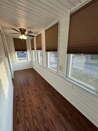 a view of a balcony with furniture