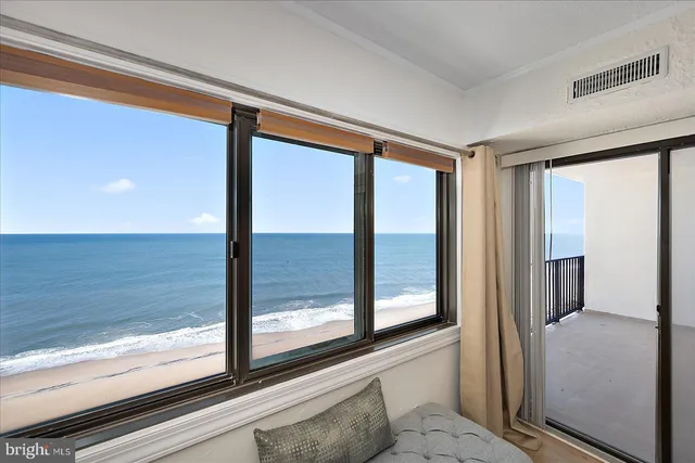 a bedroom with a bed and a night stand