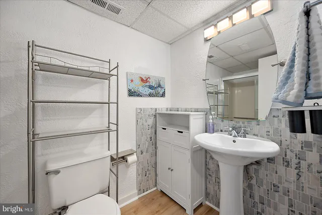 a bathroom with a glass shower door