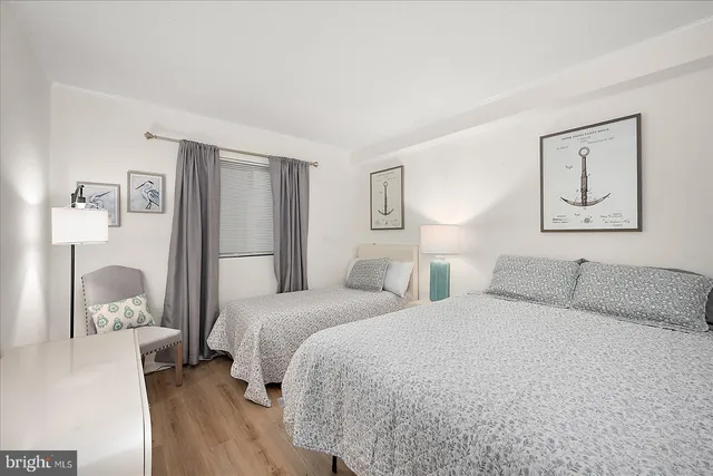 a bedroom with a large bed and a closet