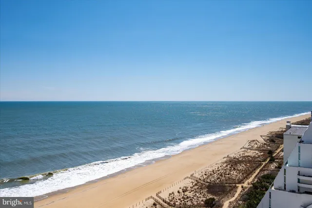a view of an ocean and a mountain