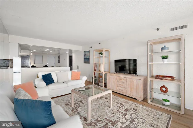 a kitchen with granite countertop a sink stove and cabinets