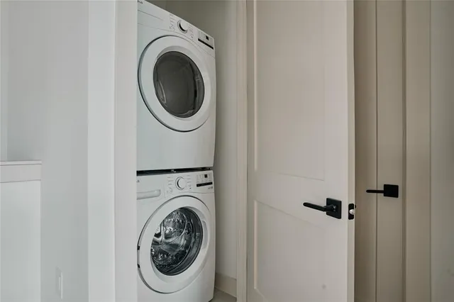 a bedroom with a bed and painting on the wall
