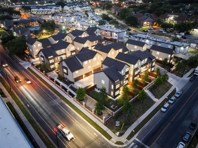 a view of house with patio outdoor seating and yard