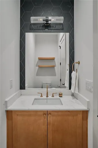 a bathroom with a sink and a mirror