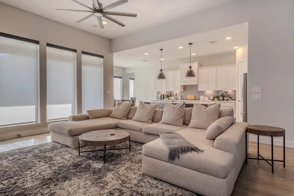 a living room with furniture and a large window
