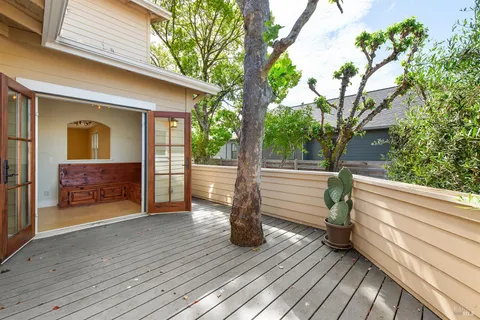 a porch with seating space and hardwood floor