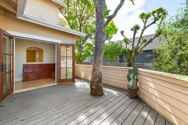 a porch with seating space and hardwood floor