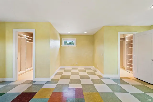 a view of bathroom with mirror and tiles