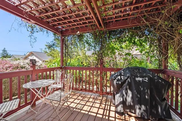 a view of a balcony with furniture