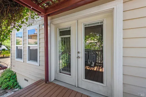 a view of a brick house with a large window