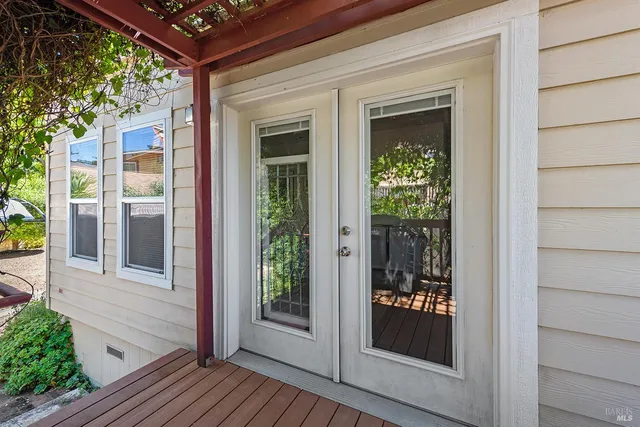 a view of a brick house with a large window