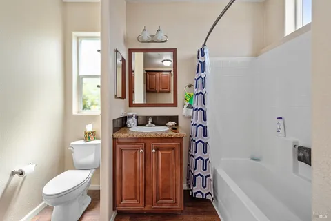 a bathroom with a toilet a sink and bathtub