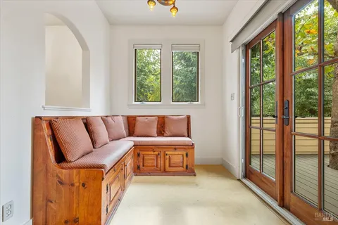 a spacious bedroom with a bed and a large window