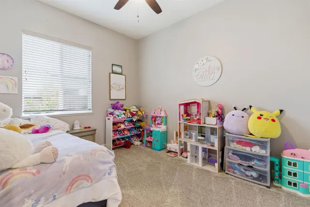 a bathroom with a tub a sink and mirror