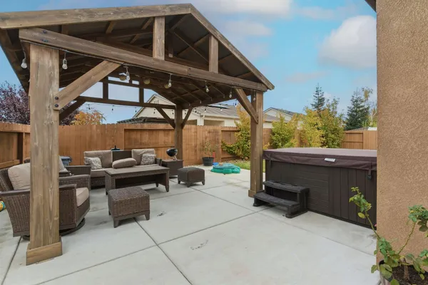 a living room with furniture a rug and a large window