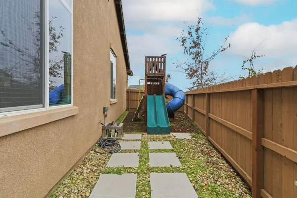 a backyard of a house with lots of green space