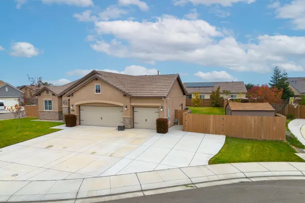 a view of a house with a backyard porch and sitting area