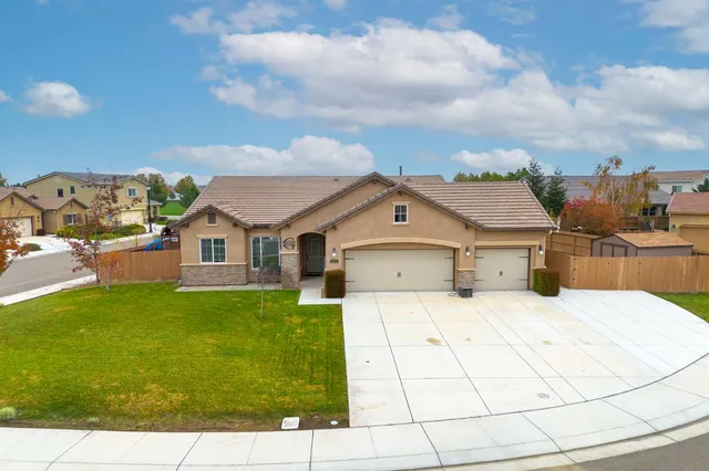 an aerial view of a house with a swimming pool