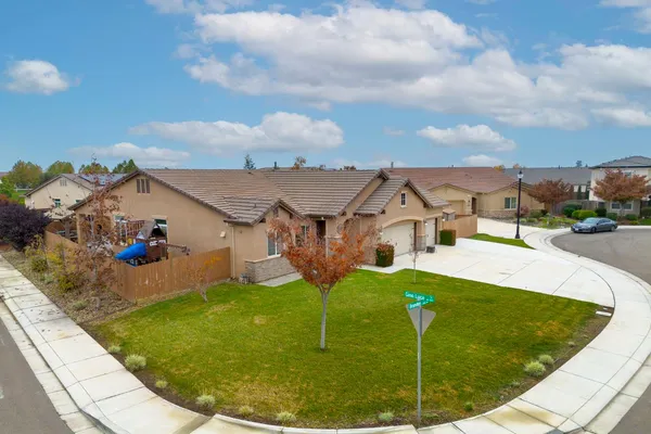 an aerial view of a house with a swimming pool