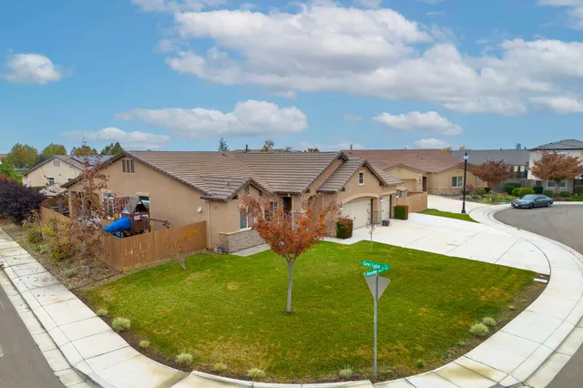 an aerial view of a house with a swimming pool