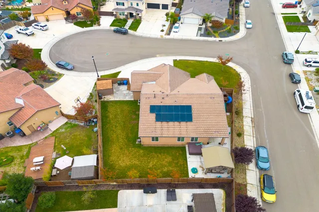 an aerial view of a house with a outdoor space
