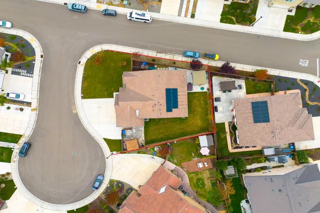 an aerial view of a house with swimming pool