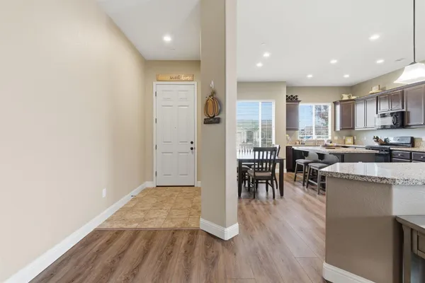 a view of kitchen with cabinets and wooden floor