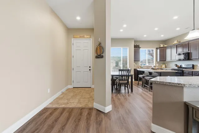 a view of kitchen with cabinets and wooden floor