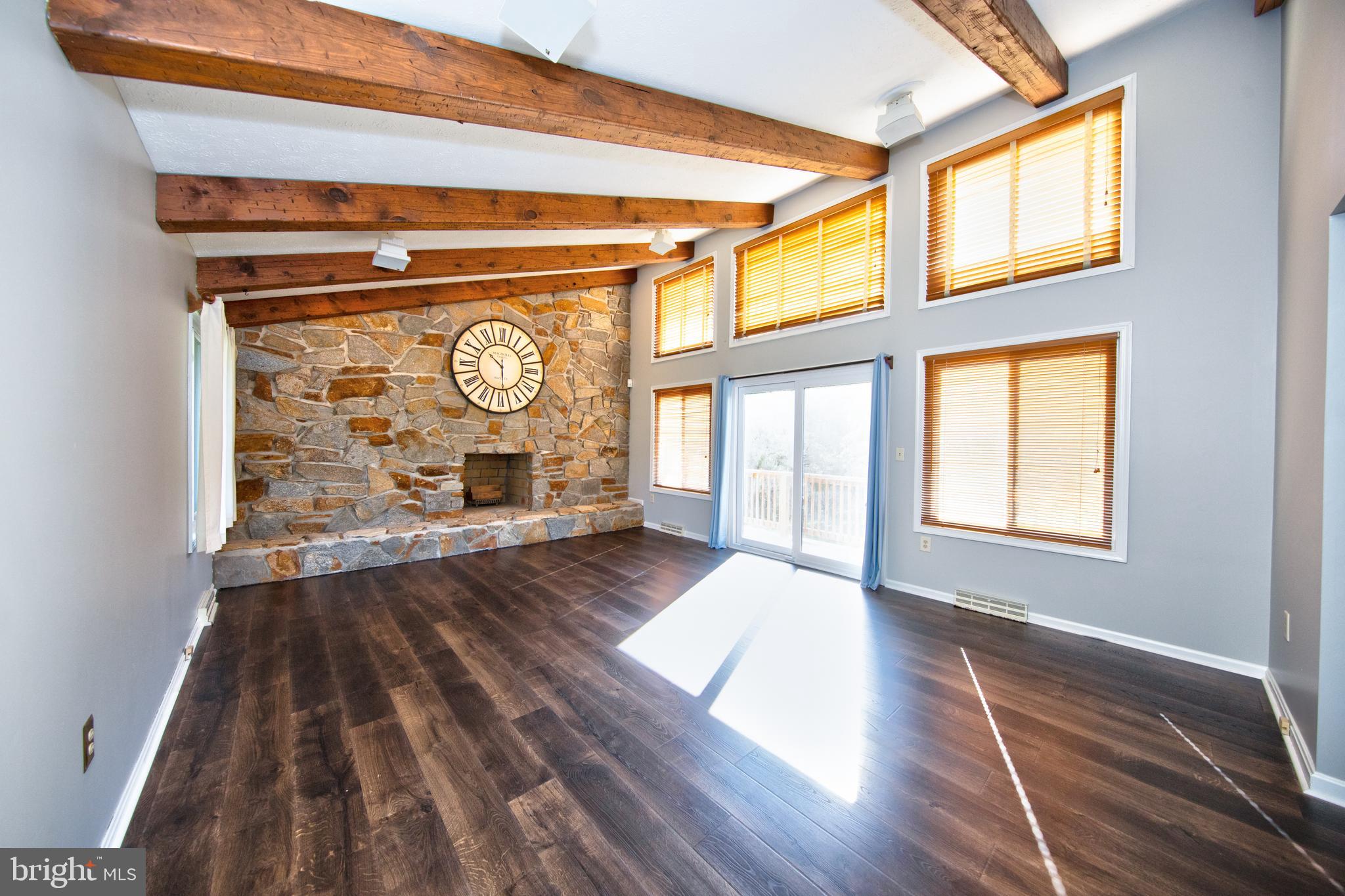 8007 Yellowstone Road Kingsville, MD 21087 - Photo 7 of 46 Living room with vaulted & wood beamed ceilings