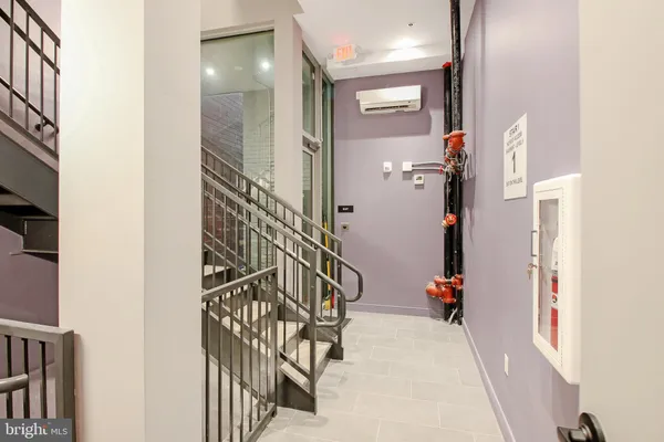 a bathroom with a shower and a glass door