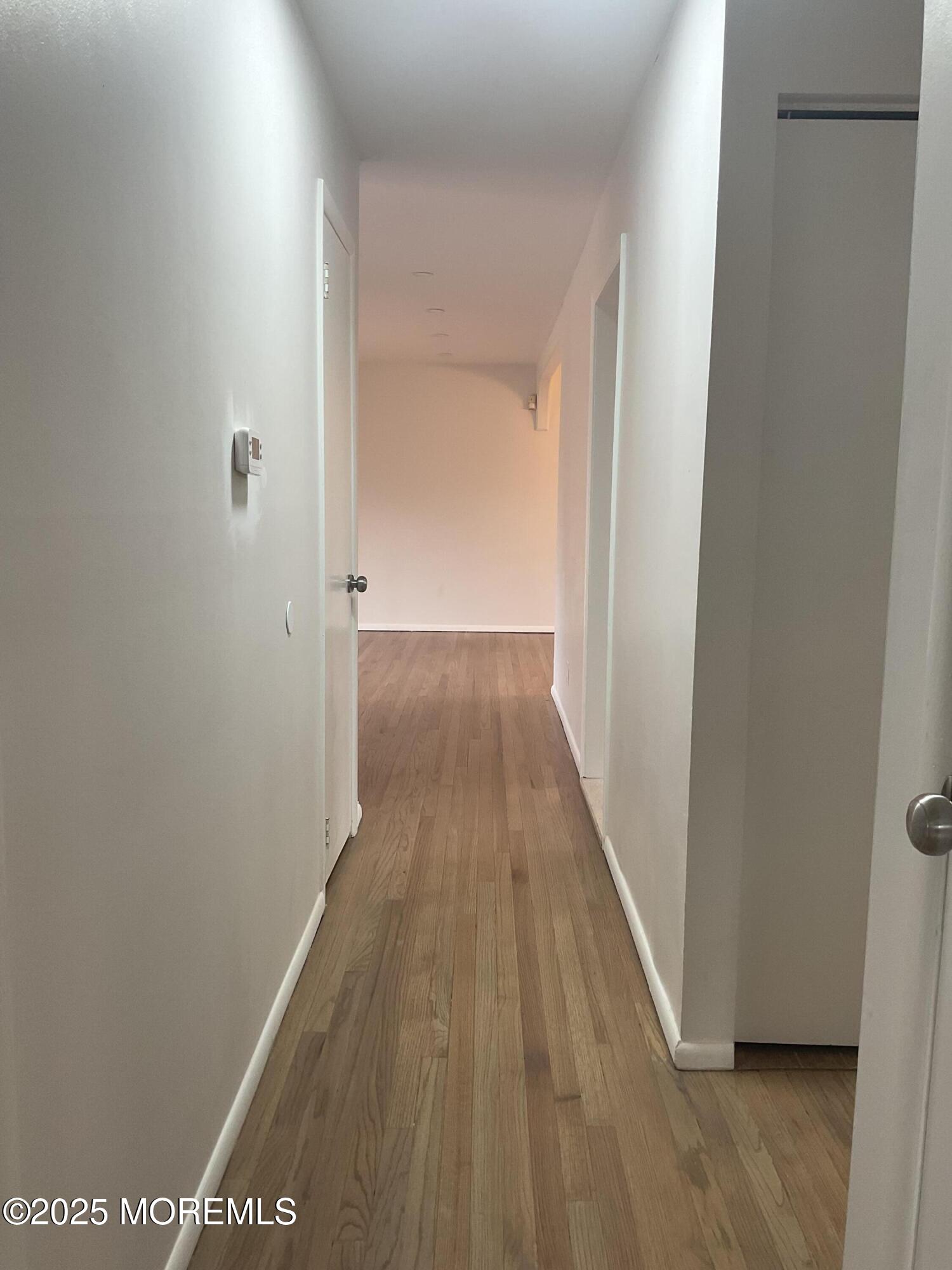 117 Greymoor Road Howell, NJ 07731 - Photo 16 of 41 a view of a hallway with wooden floor
