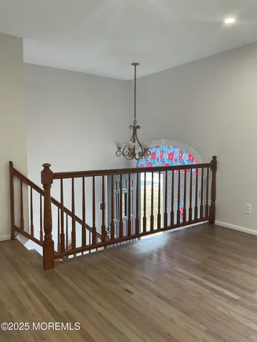 a view of wooden floor and fire place in a room