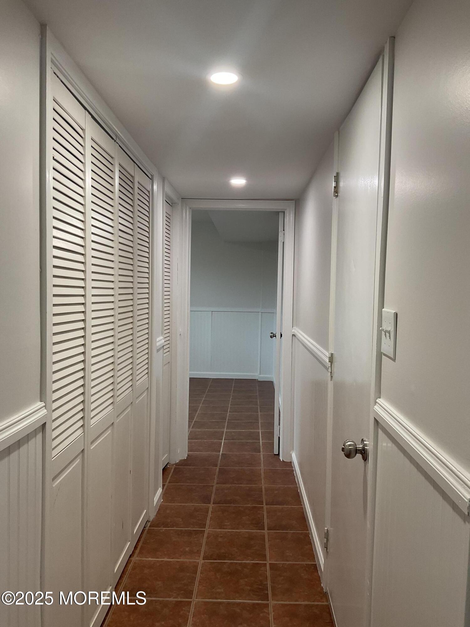 117 Greymoor Road Howell, NJ 07731 - Photo 32 of 41 a view of a hallway with wooden floor and a large window