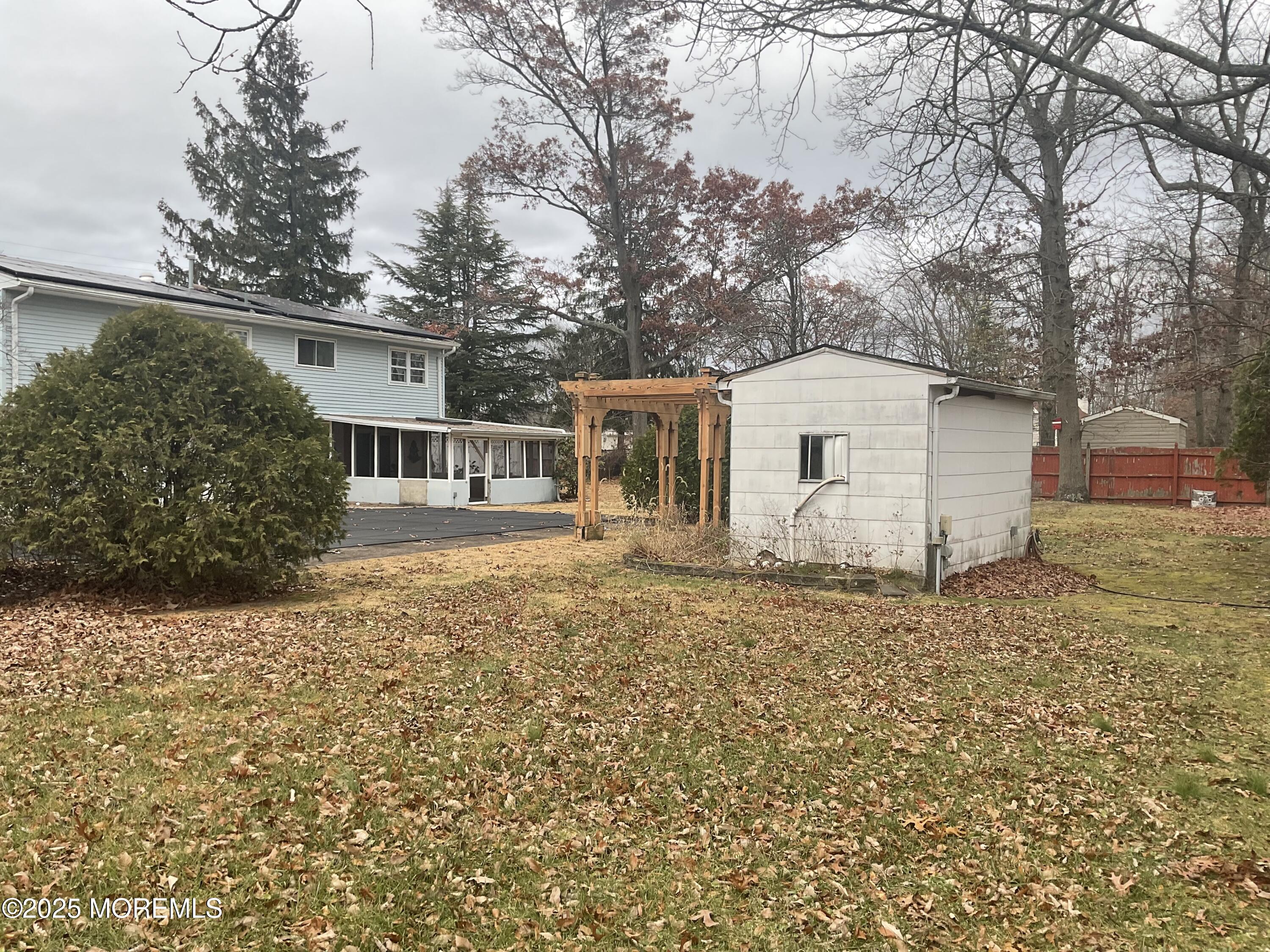 117 Greymoor Road Howell, NJ 07731 - Photo 39 of 41 a front view of house with yard and trees