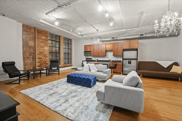 a living room with fireplace furniture and a flat screen tv