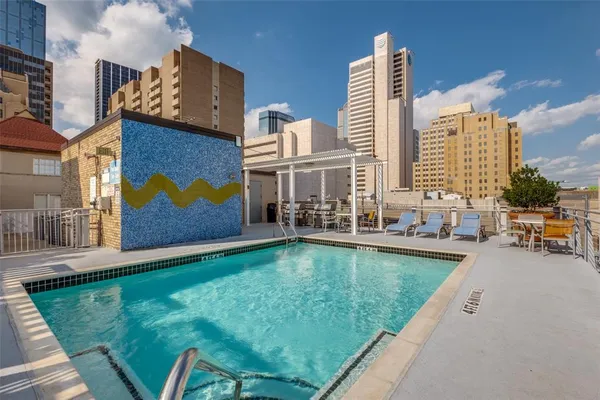 a view of swimming pool with outdoor seating