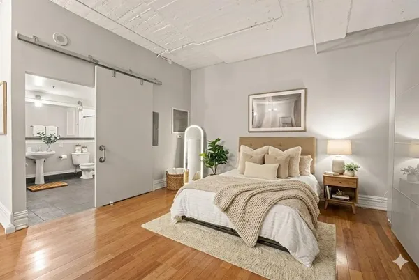 a bedroom with a bed and a view of bathroom