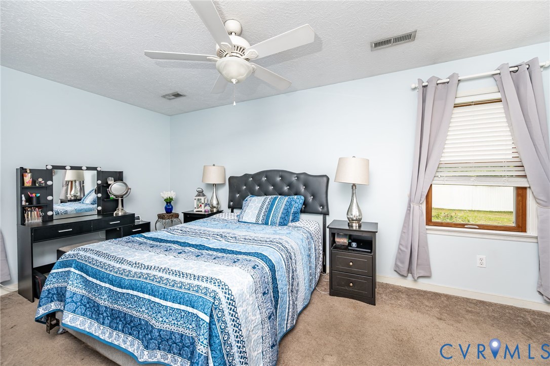 6327 Draperfield Road Mechanicsville, VA 23111 - Photo 17 of 23 Bedroom featuring carpet, a textured ceiling, and