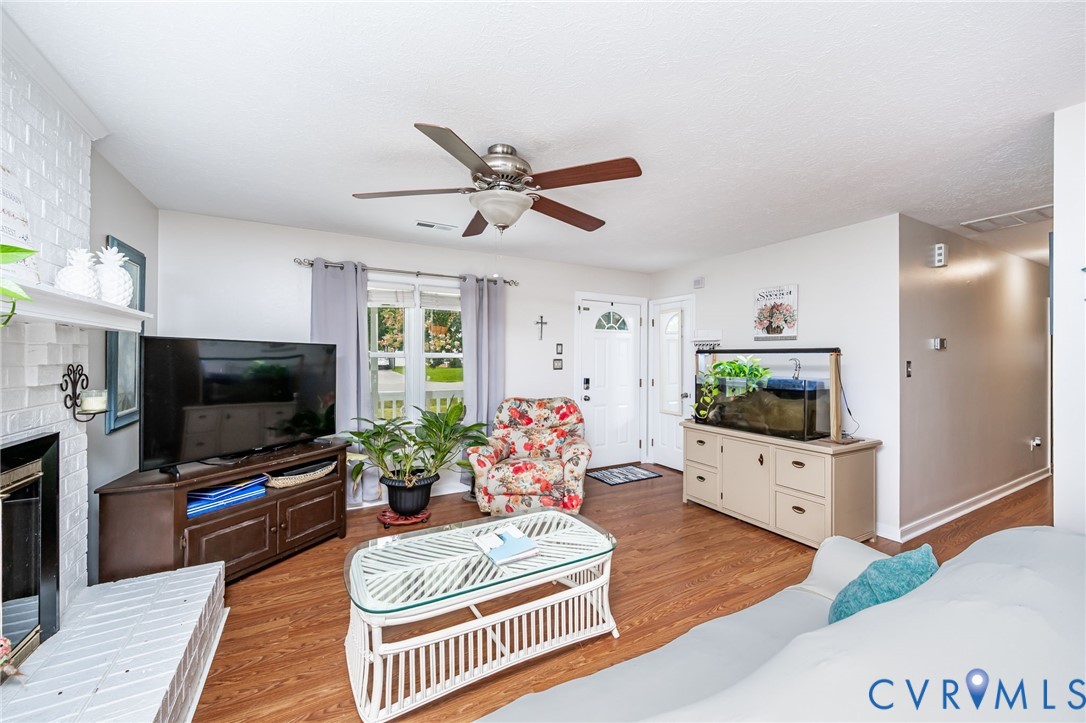 6327 Draperfield Road Mechanicsville, VA 23111 - Photo 8 of 23 Living room with light wood-style flooring, a bric
