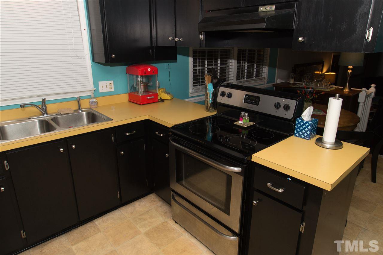 4125 Pittsford Road Raleigh, NC 27604 - Photo 11 of 20 a kitchen with stainless steel appliances granite countertop a sink stove and cabinets