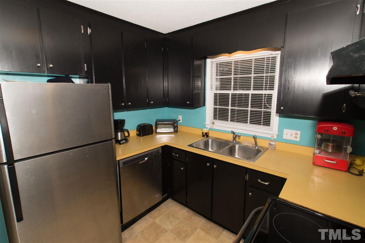 4125 Pittsford Road Raleigh, NC 27604 - Photo 12 of 20 a kitchen with a refrigerator and a sink