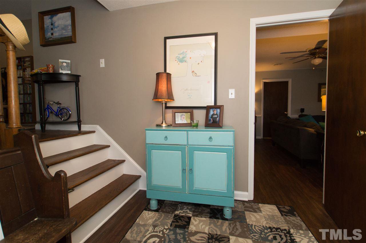 4125 Pittsford Road Raleigh, NC 27604 - Photo 4 of 20 a bedroom with a bed and a mirror