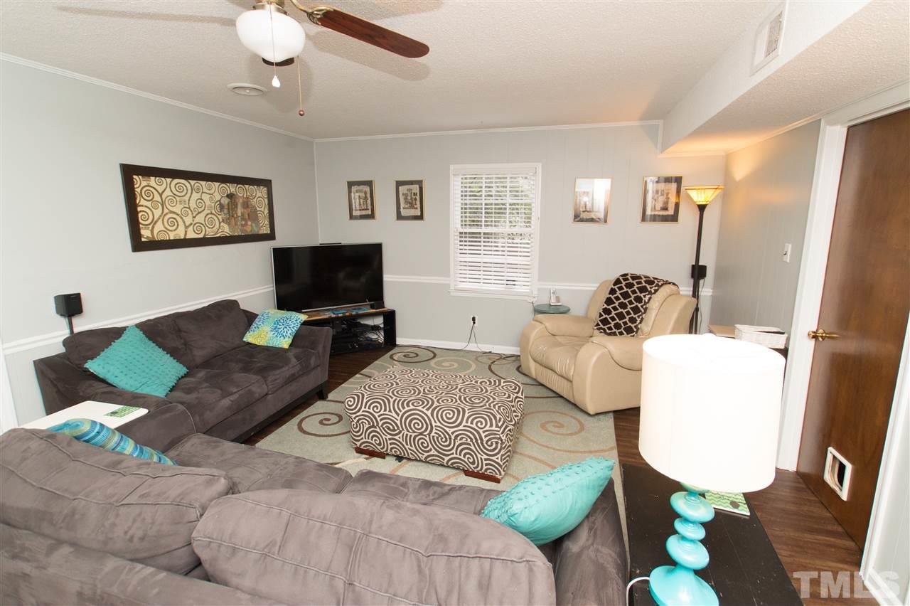 4125 Pittsford Road Raleigh, NC 27604 - Photo 5 of 20 a living room with furniture and a flat screen tv