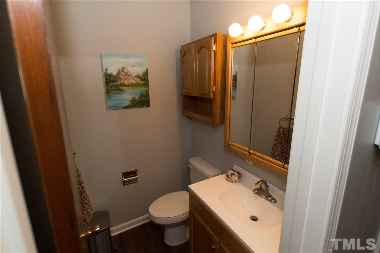 4125 Pittsford Road Raleigh, NC 27604 - Photo 6 of 20 a bathroom with a sink and mirror with toilet