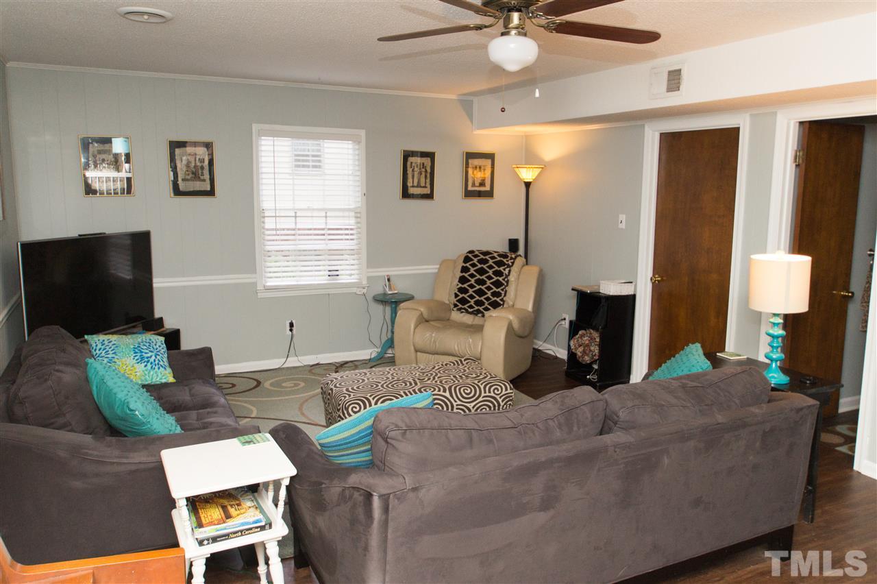 4125 Pittsford Road Raleigh, NC 27604 - Photo 7 of 20 a living room with furniture and a flat screen tv