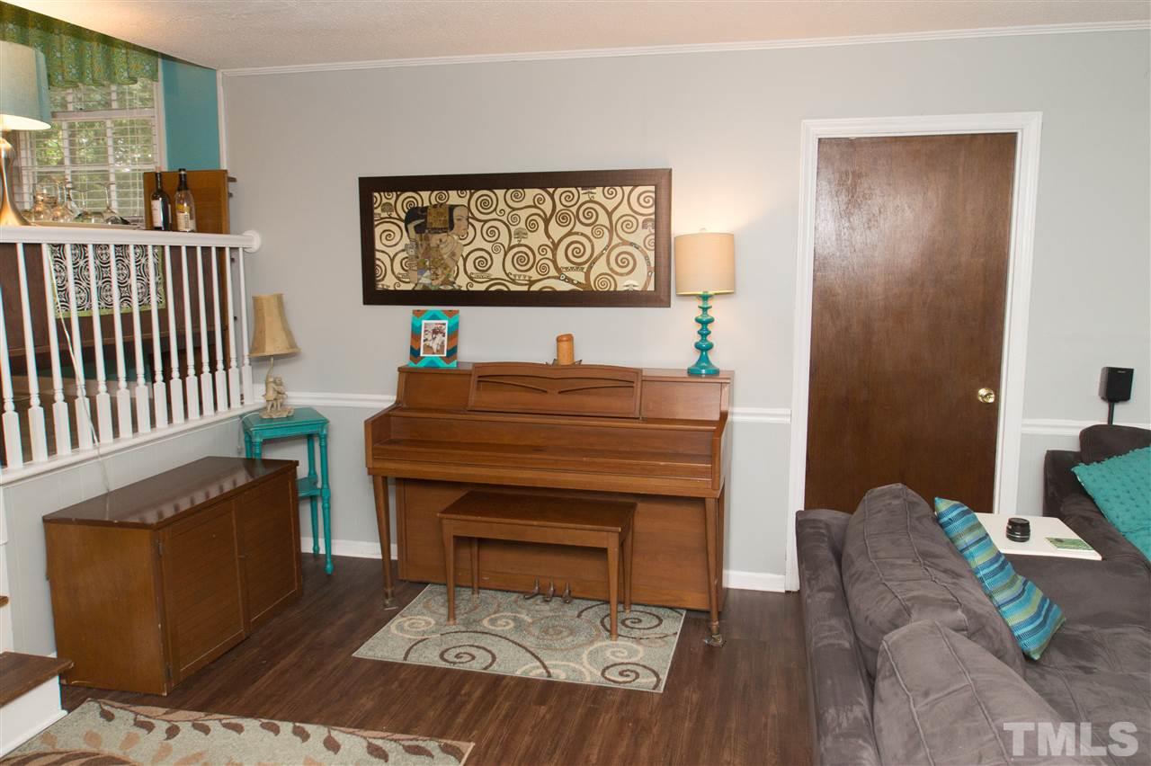 4125 Pittsford Road Raleigh, NC 27604 - Photo 8 of 20 a living room with furniture and a piano